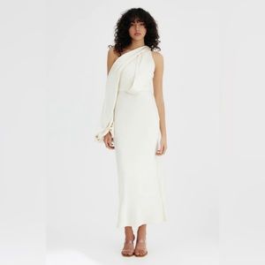 Midi fitter waist, relaxed throughout, asymmetrical draped shoulder design.